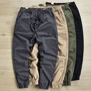 Breathable cotton blend pants with button closure – mid-waist fit.