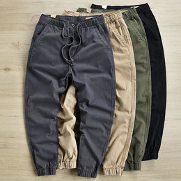 Breathable cotton blend pants with button closure – mid-waist fit.