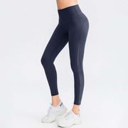 Butt lifting workout leggings for women in navy, high-waisted, seamless design for comfort and style during any workout.