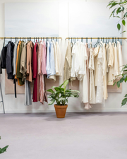 Variety of clothing items neatly arranged on display racks.