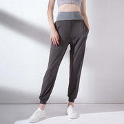 High waist grey yoga pants with fitted cuff and a comfortable waistband, ideal for workouts and active lifestyles.