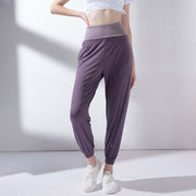 High waist purple yoga pants with a stylish design and comfortable fit for women's activewear.