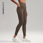 High waist tea brown yoga pants for women, perfect for workouts and casual wear, featuring a snug fit and side pockets.
