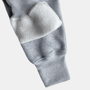 Close-up of the sleeve detail on Reqidas Men's Future Summit Fleece Tracksuit, showcasing soft fleece material.