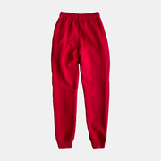 Men's red fleece trousers with elastic waistband, perfect for outdoor activities and cozy relaxation.