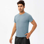 Men's loose fit quick-dry running t-shirt in light blue, designed for comfort during workouts and sports activities.