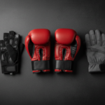 Boxing, cycling and winter sports gloves arranged together on a dark surface